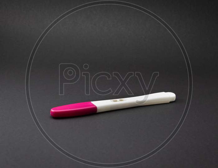Pink and white pregnancy test