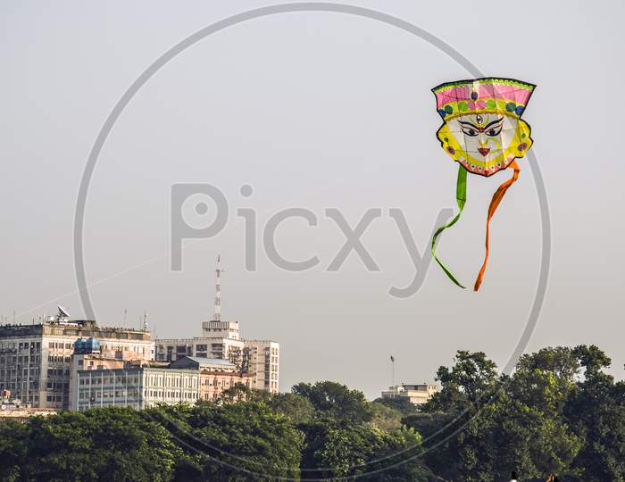 A kite is flying in the city of Kolkata.