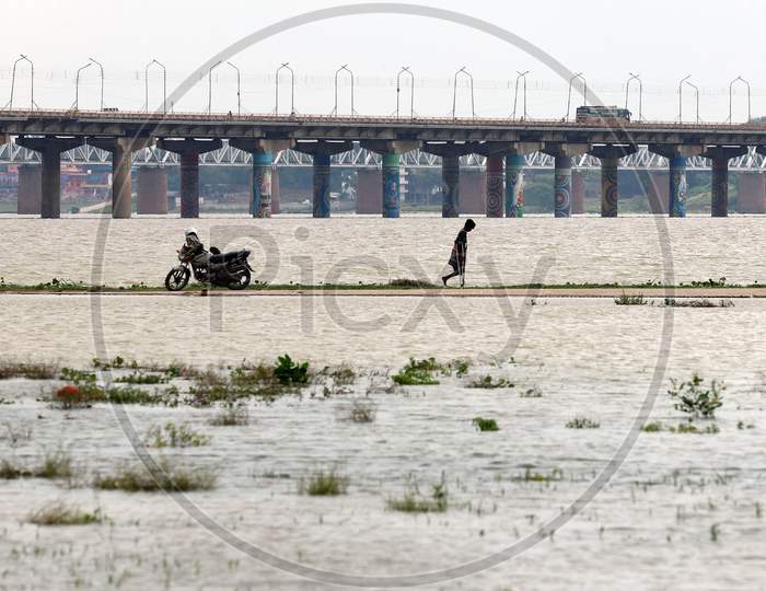 A Man Cross The Flood Water Of River Ganga In Prayagraj, August 29, 2020.
