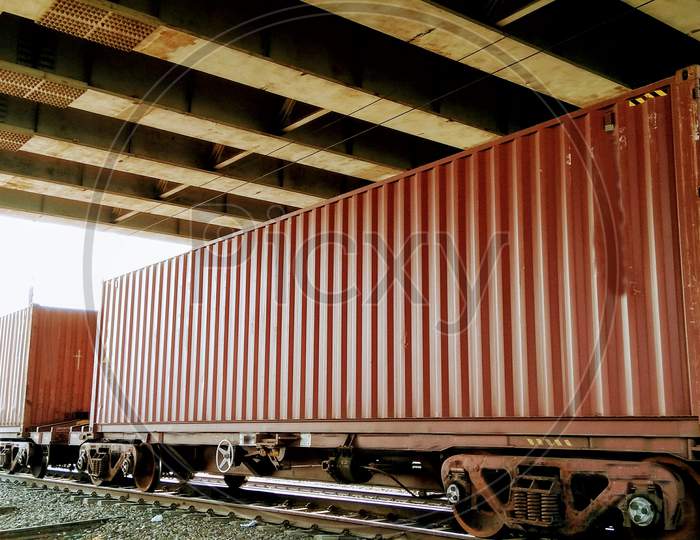 Containers loaded on train wagons on a railway
