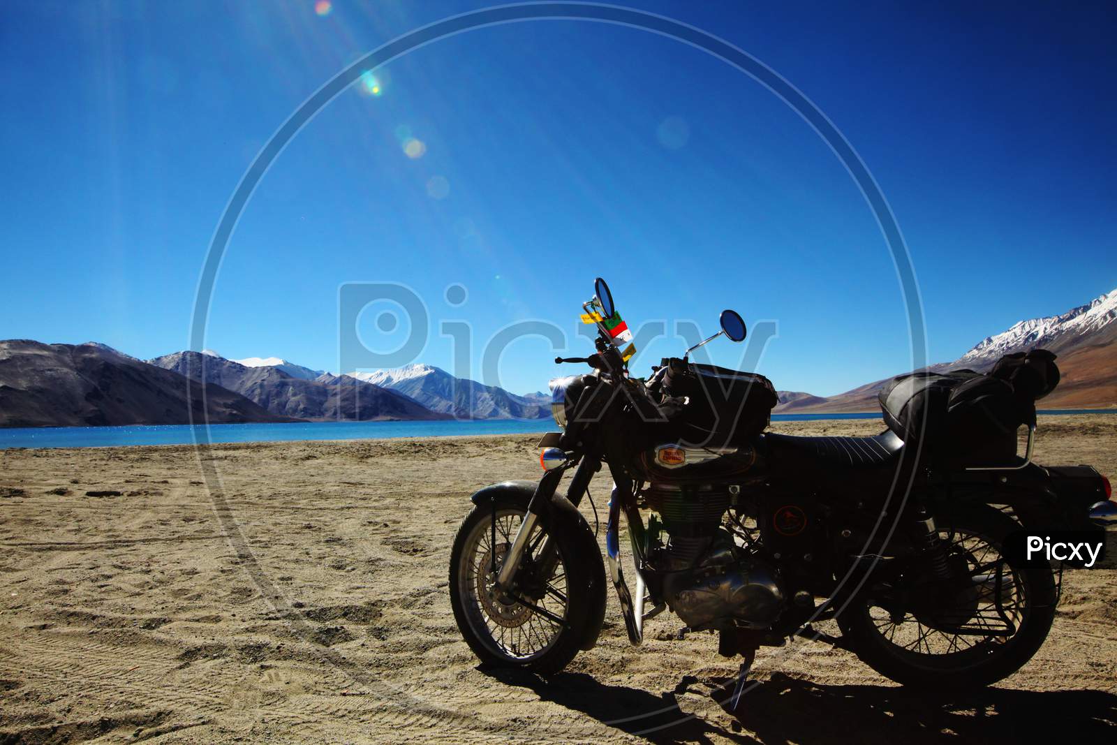 A Bike with Mountains of Leh and Pangong Tso Lake in the Background