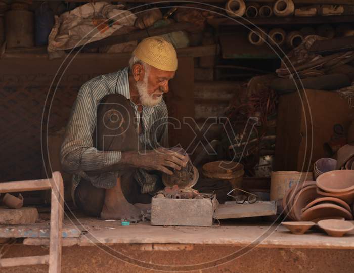 Portrait of an Old Potter at Work