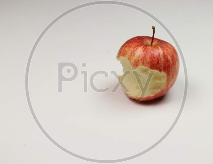 A Half Eaten Apple Fruit isolated on white background