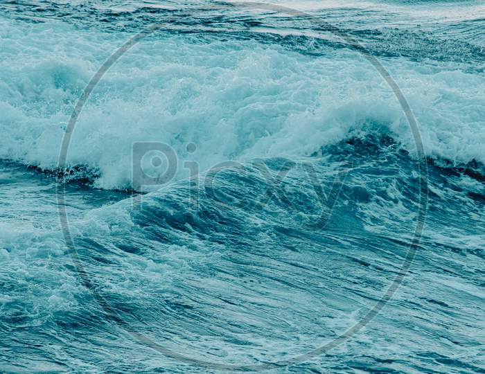A Blue And Compose Wave In The Sea