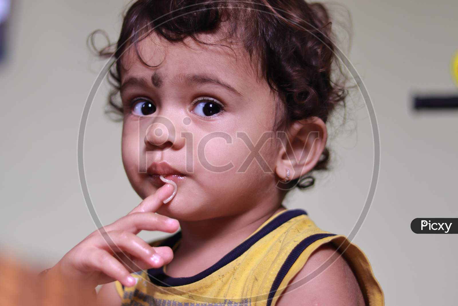 A Beautiful Indian Child Eats Semia
