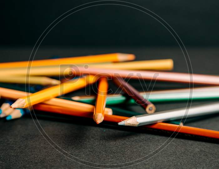 A Bokeh Of A Bunch Of Colorful Pencils Lying On Each Other