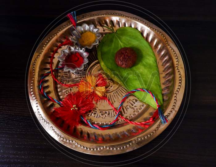 Top View Of Designed Raksha Bandhan In Colorful Threads Isolated