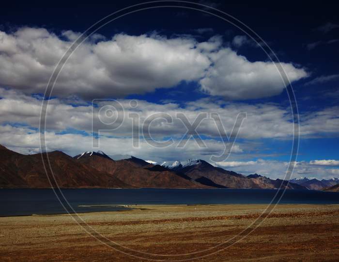 Snow Capped Mountains of Leh with a lake in the Foreground