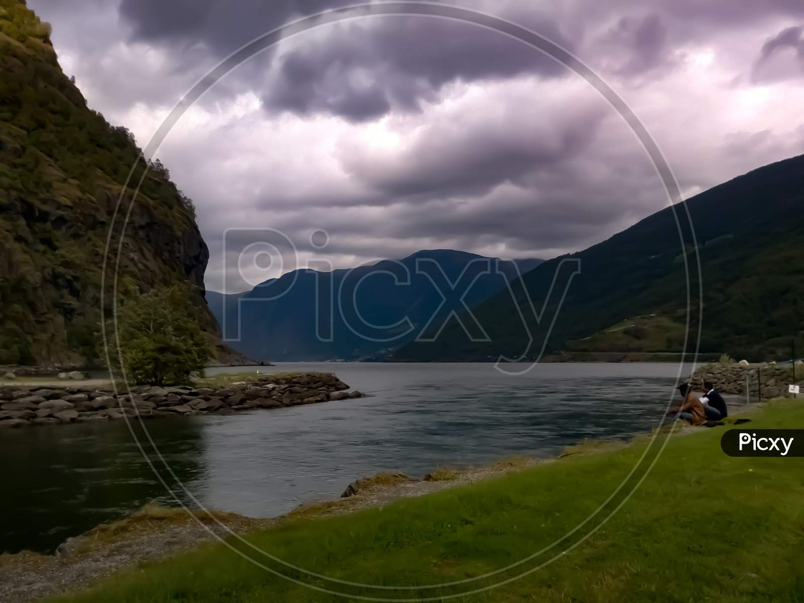 View Of Lake And Mountains Under Cloudy Sky Near Flam Cruise Port Norway