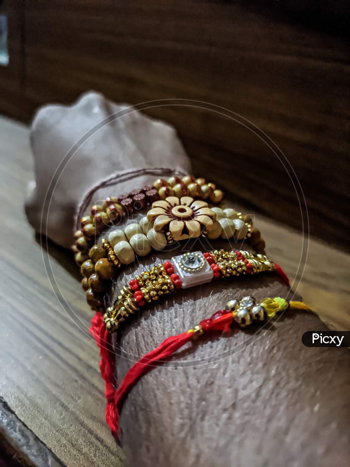 A licture of rakhi in a hand