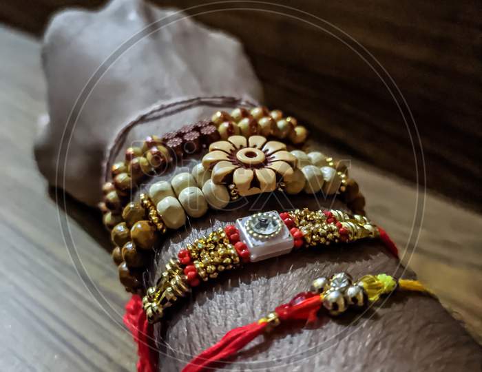 A licture of rakhi in a hand