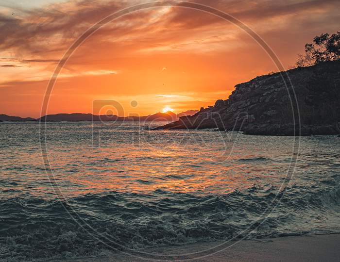 A Colorful Sunrise In The Beach In Spain