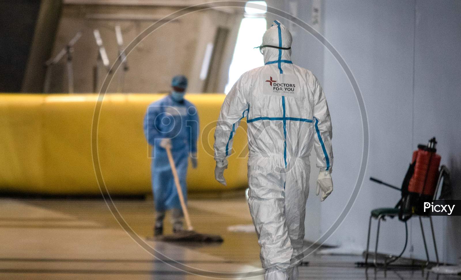 A health worker  wearing a PPE suit entering the isolation wards at the Commonwealth Games Village Sports Complex which has been temporarily converted into a Coronavirus Care Centre in New Delhi on August 3, 2020