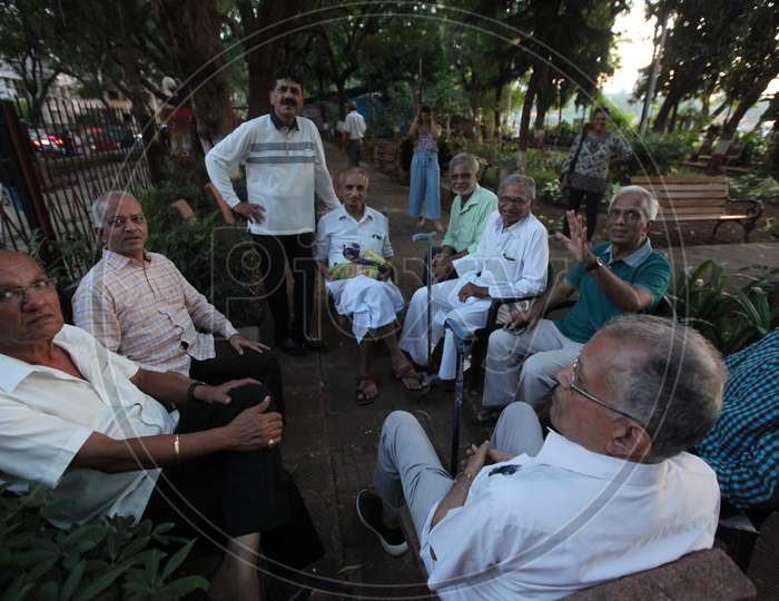 A Group of Old People posing towards the Camera