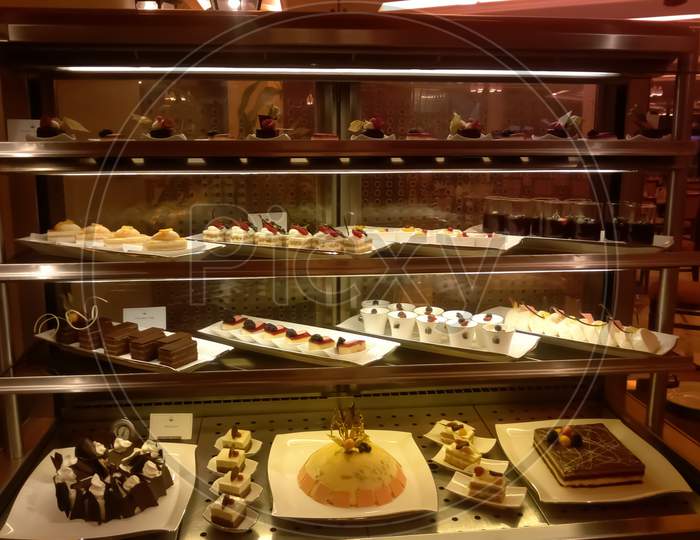 Buffet Counter ,Selection Of French Pastries ,Cream And Fruit Cakes