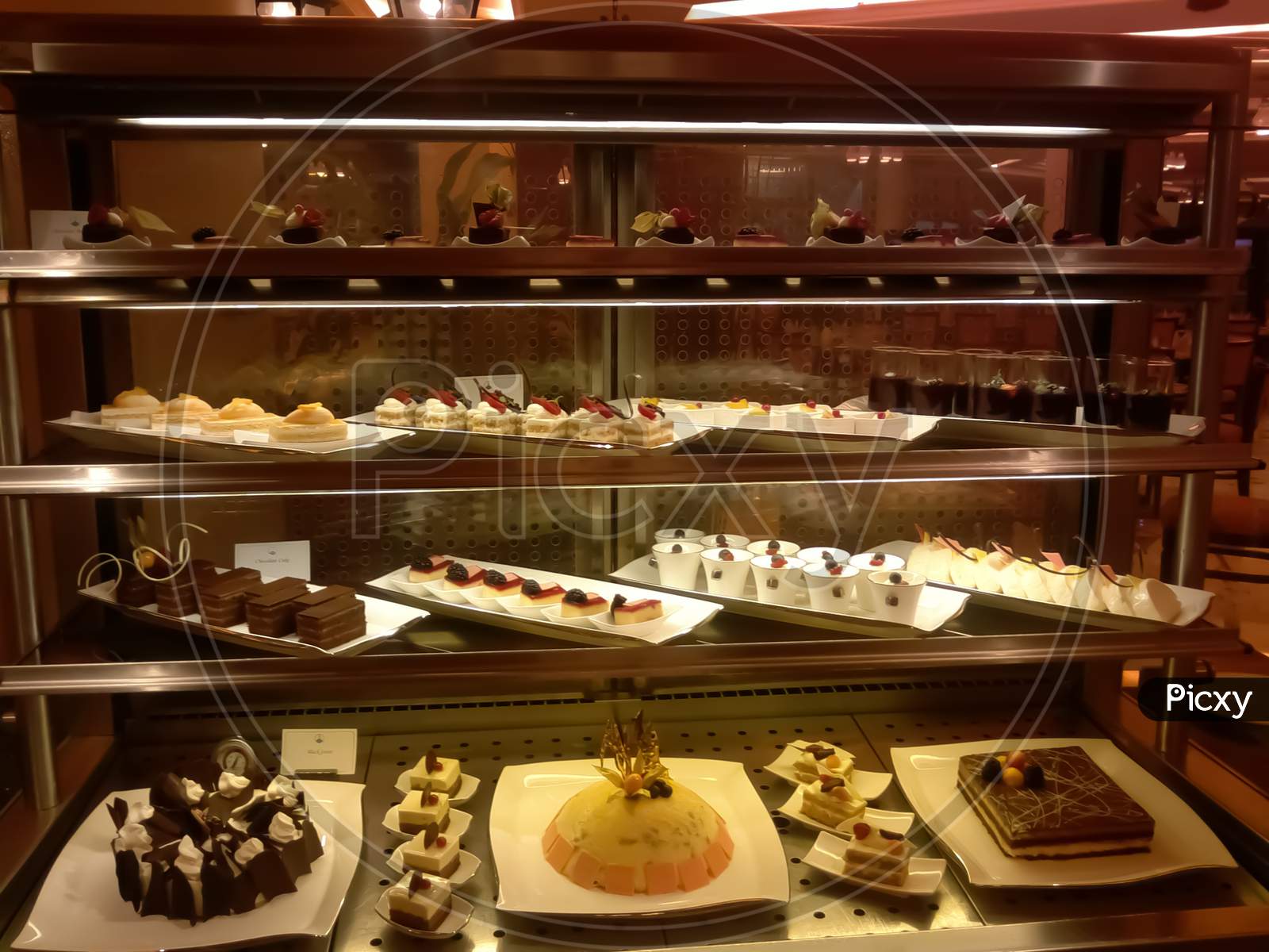 Buffet Counter ,Selection Of French Pastries ,Cream And Fruit Cakes