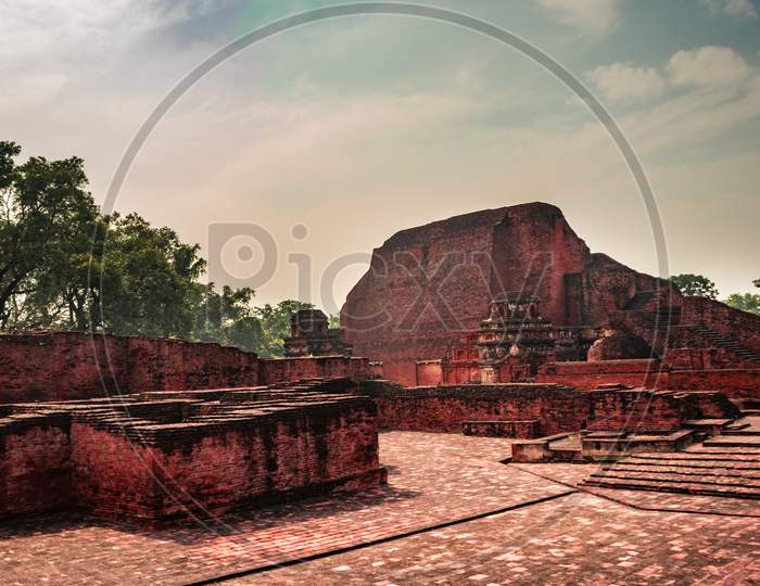 Nalanda University Ruins ,The First Buddhism University With Blue Clear Sky In Bihar State In India