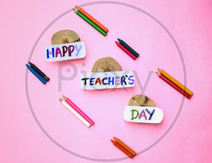 Happy Teacher's Day Creative Photo With Color Pencils Isolated On Pink Background, Perfect For Wallpaper