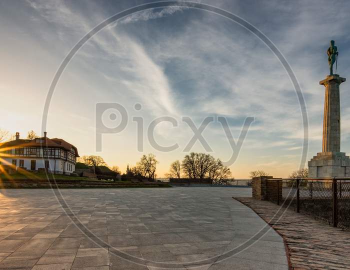 Plateau On Belgrade Fortress With Victor Monument At Sunrise In Belgrade, Serbia