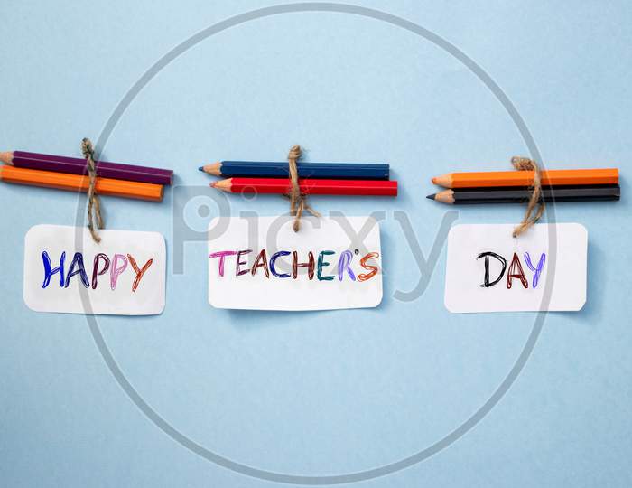 Happy Teacher's Day Wish Written On Paper Note With Color Pencils, Perfect For Wallpaper