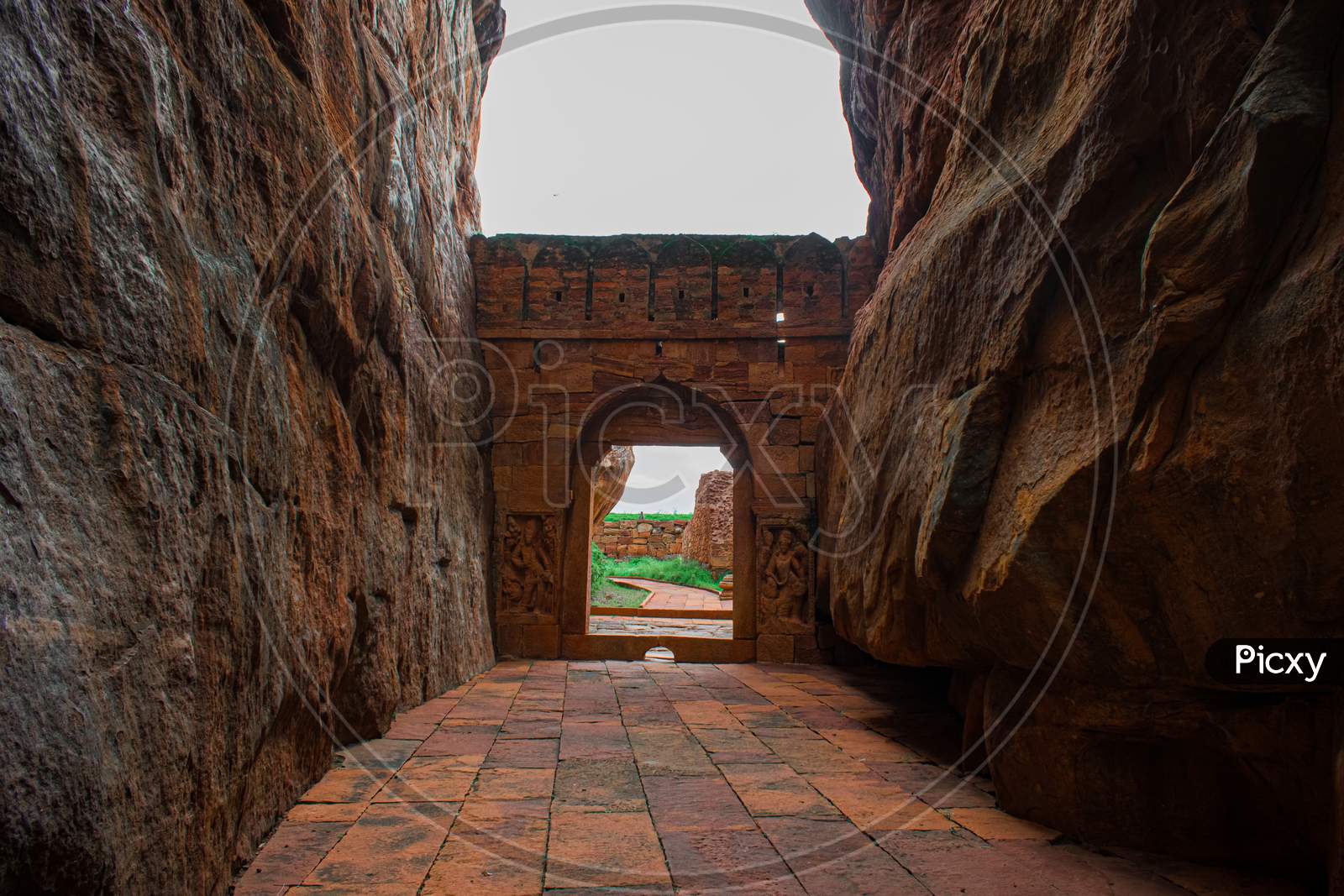 Entrance wall built in between the two big  sandstone rocks in Badami, Karnataka.