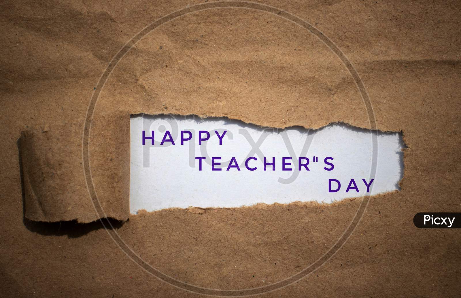 Happy Teacher'S Day Wish Written Amid Torn Paper