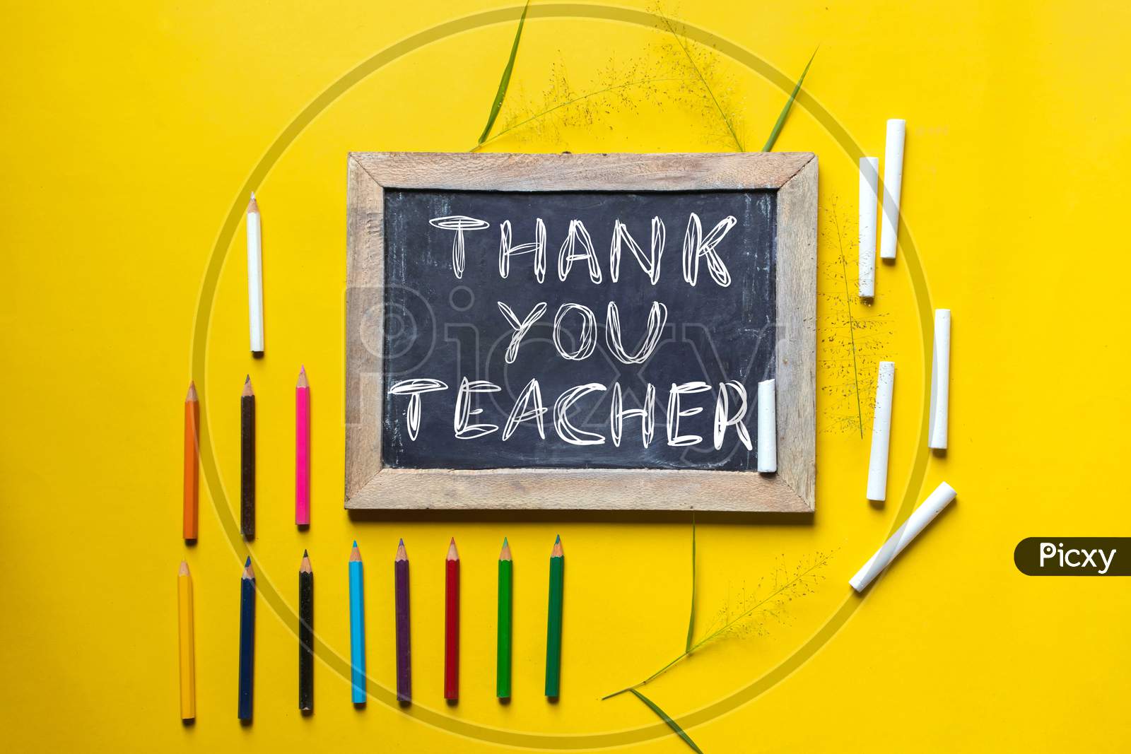 Thank You Teacher Written On Slate Board With Chalk And Color Pencils, Happy Teacher's Day Conceptual Photo