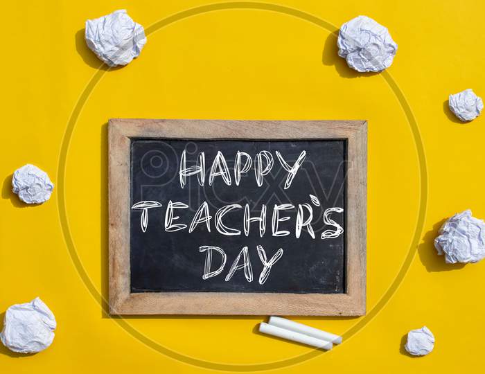 Happy Teacher's Day Creative Photo With Slate Board And Crumpled Paper Balls, Perfect For Wallpaper