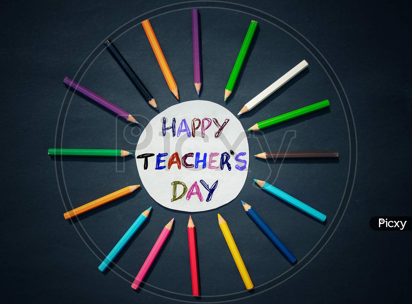 Happy Teacher's Day Creative Photo With Color Pencils On Black Background, Perfect For Wallpaper