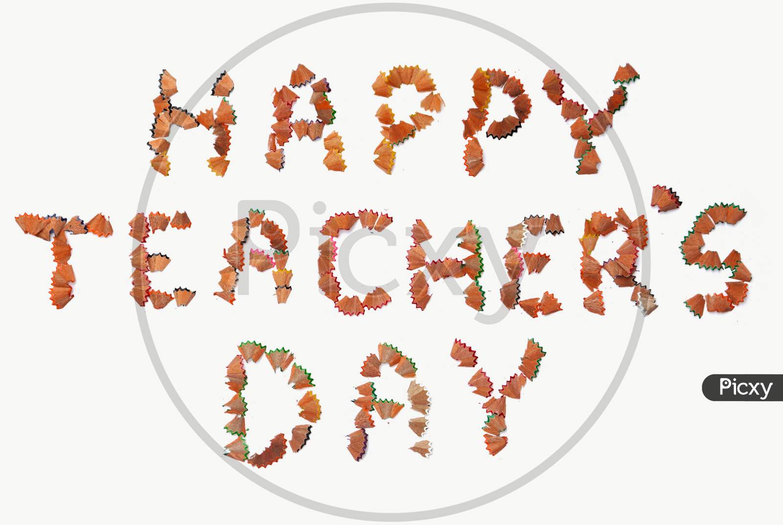 Happy Teacher'S Day Wish Written With Pencil Shavings Parts On White Background
