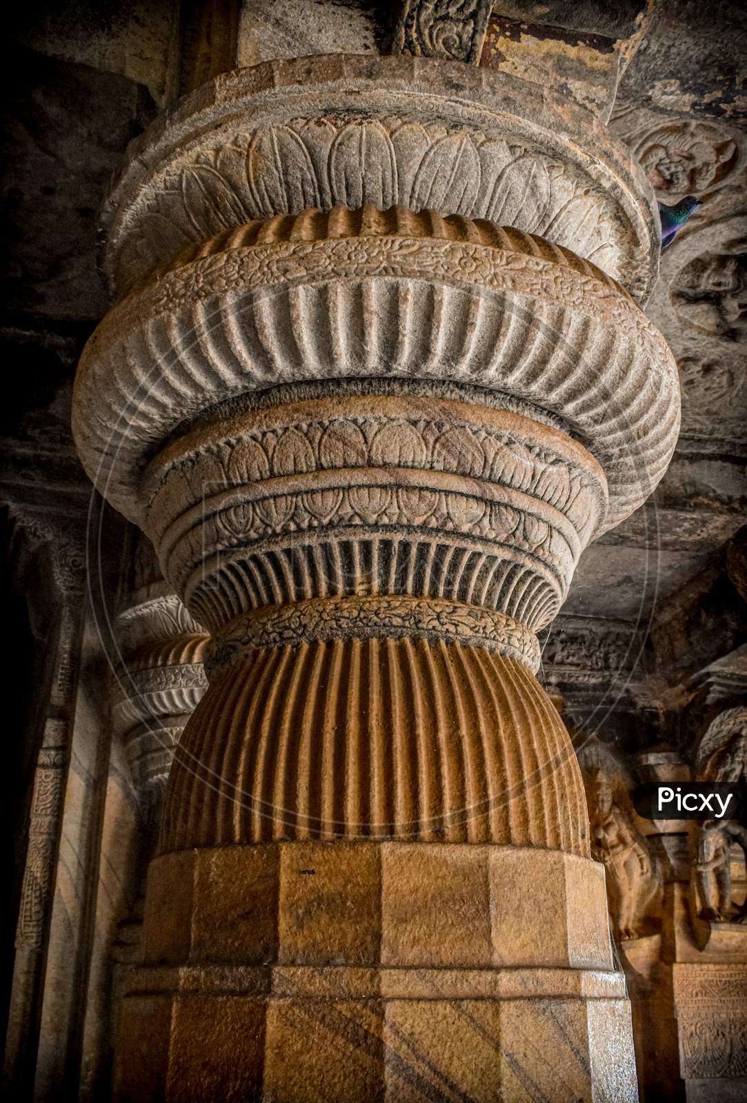 Ancient Indian stone pillar carved design in badami , Karnataka.