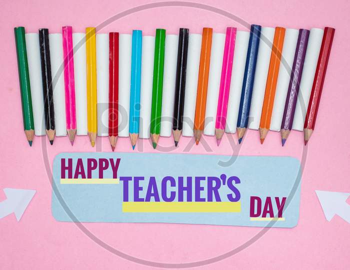Creative Photo Of Happy Teacher's Day With Color Pencils And Chalks