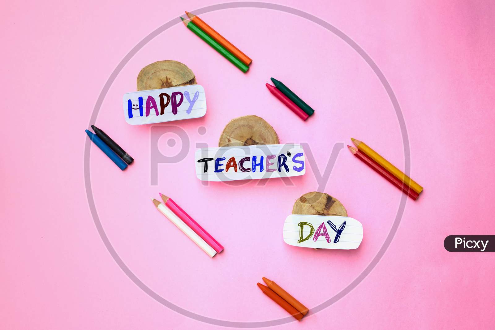 Happy Teacher's Day Creative Photo With Color Pencils Isolated On Pink Background, Perfect For Wallpaper