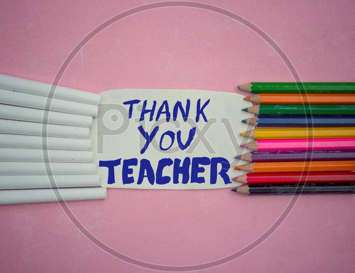 Thank You Teacher Written On Paper Note With Color Pencils And White Chalk, Happy Teacher's Day Conceptual Photo