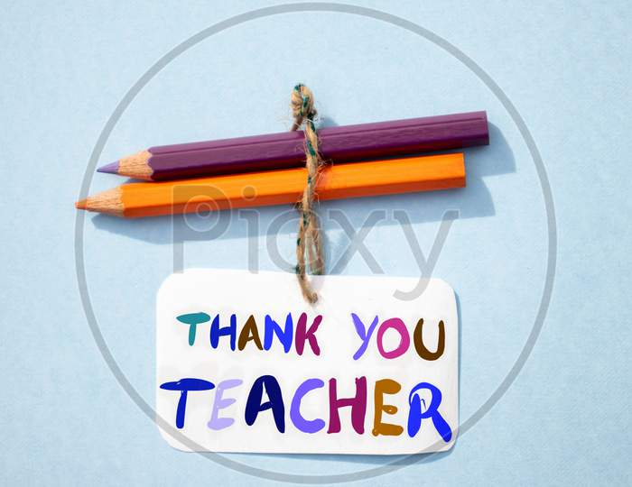 Thank You Teacher Written On Paper Note With Color Pencils, Happy Teacher's Day Conceptual Photo