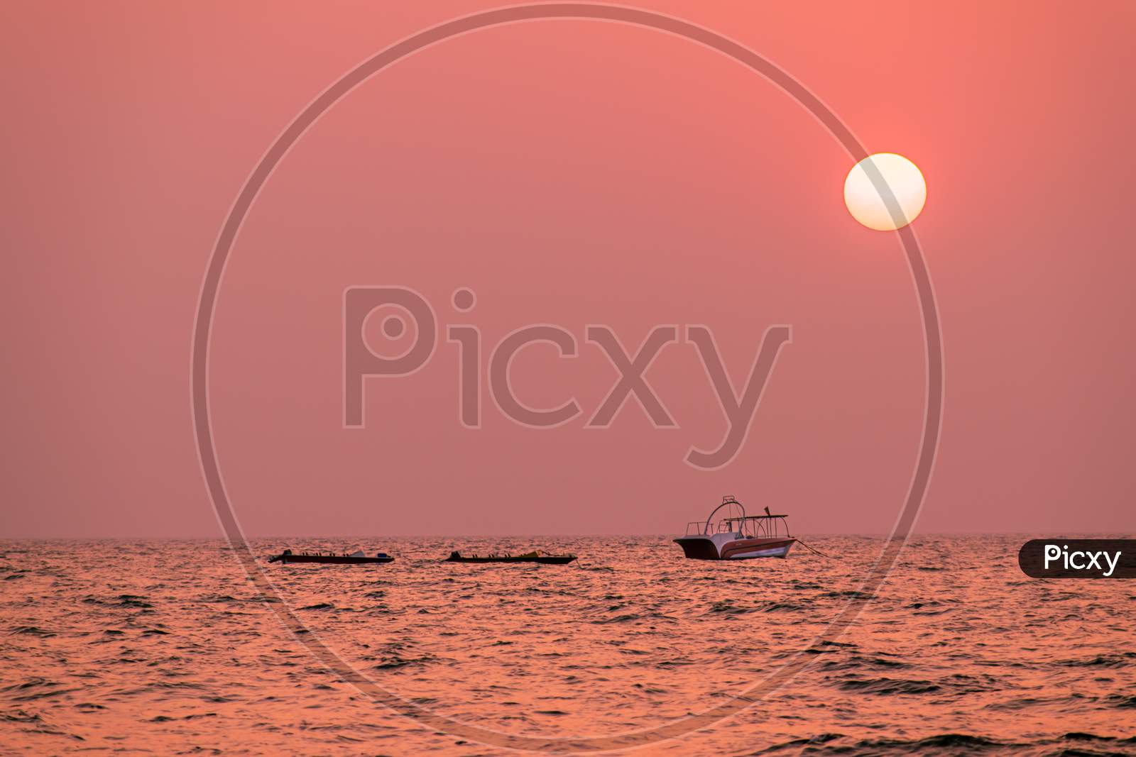 beautiful view of a sunsetat  goa sea and a boat