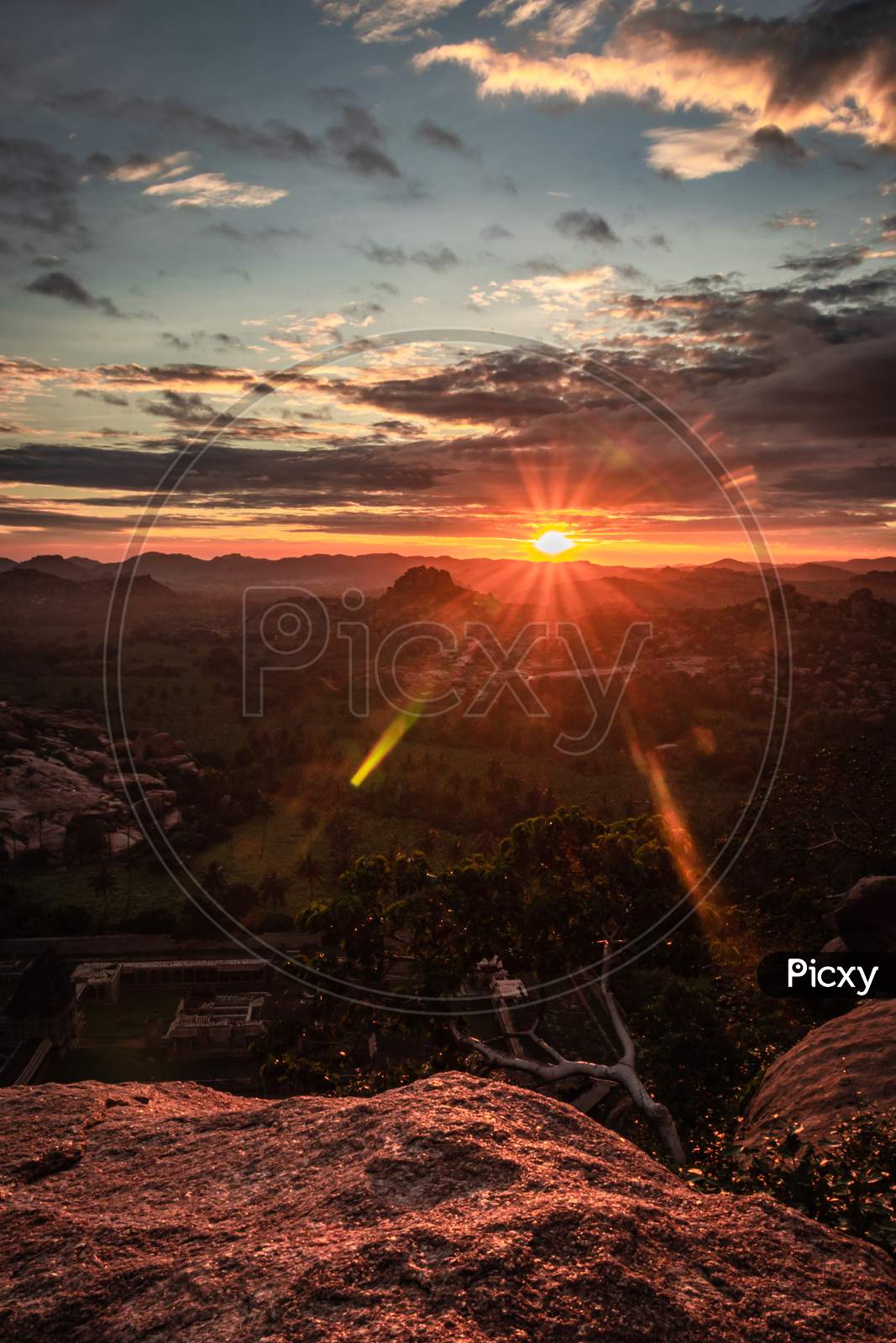 Rocky Mountain Sunrise Flares With Dramatic Sky At Morning Flat Angle Shot