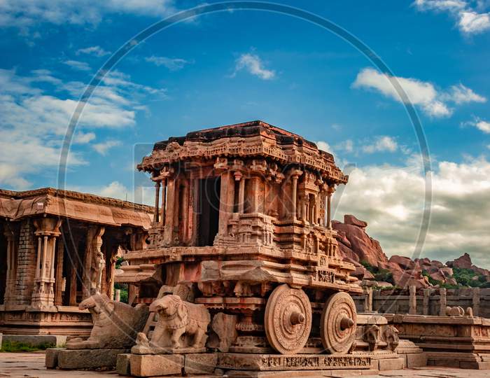Hampi Stone Chariot The Antique Stone Art Piece With Amazing Blue Sky At Vithala Temple