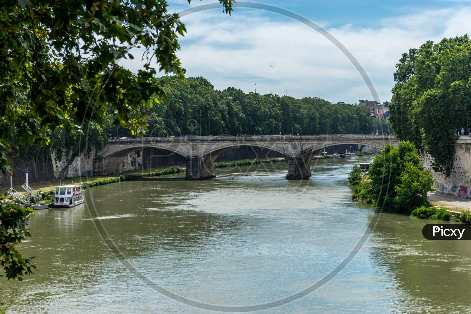 Italy, Rome, Roman Forum, A Train Crossing A Bridge Over A Body Of Water