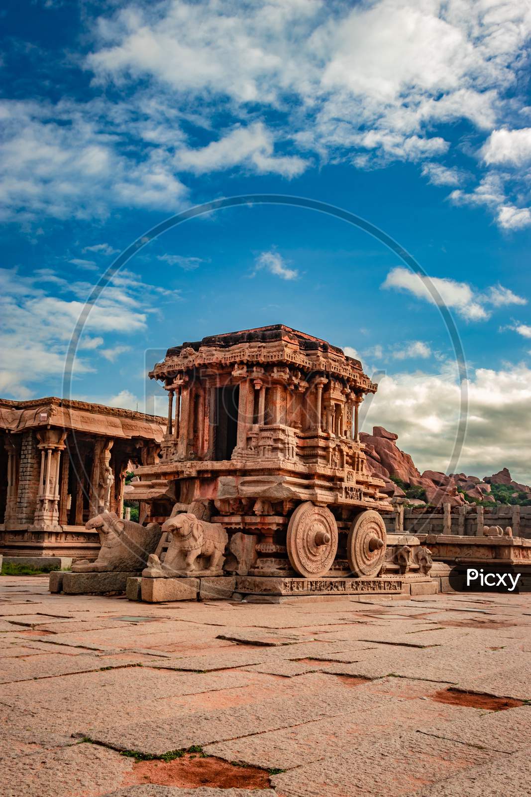 Hampi Stone Chariot The Antique Stone Art Piece With Amazing Blue Sky At Vithala Temple