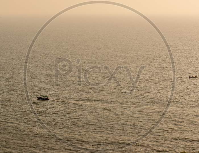 beautiful view of a goa sea and a boat