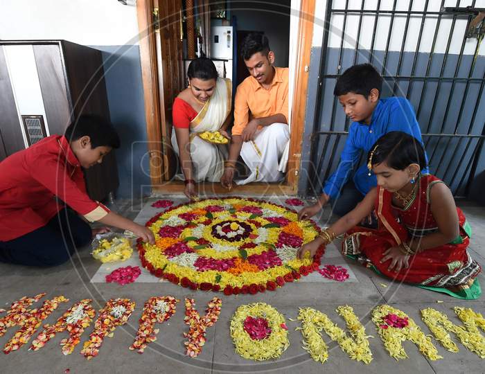 A Family Prepares 'Pookalam' On The Eve Of Onam Festival, In Chennai, Monday, August 31, 2020.