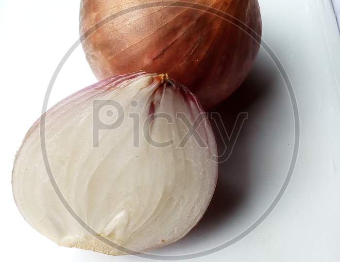 Half cutd and a one whole onion background white