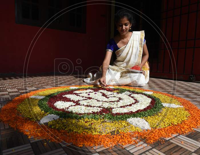 A Young Woman Prepares 'Pookalam' On The Eve Of Onam Festival, In Chennai, Monday, Aug. 31, 2020.