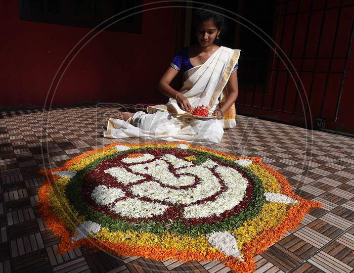 A Young Woman Prepares 'Pookalam' On The Eve Of Onam Festival, In Chennai, Monday, Aug. 31, 2020.