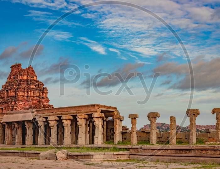 Vithala Temple Hampi Ruins Antique Stone Art From Unique Angle With Amazing Blue Sky