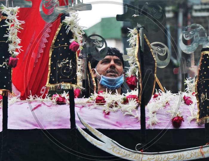Shia Muslims take part in a Muharram procession to mark Ashura, that was carried out with tight security amid coronavirus pandemic in Mumbai, India on August 30, 2020.