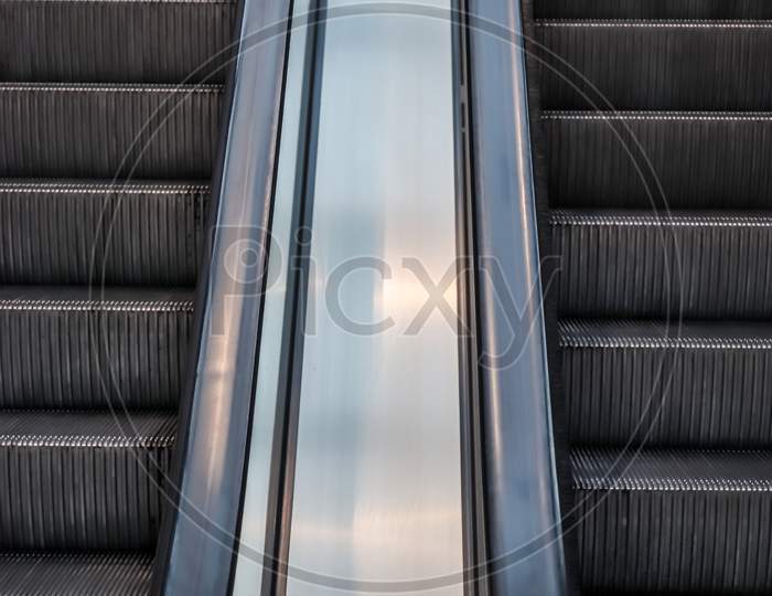 Close Up Of Empty Steps Of An Escalator In A Perspective View.