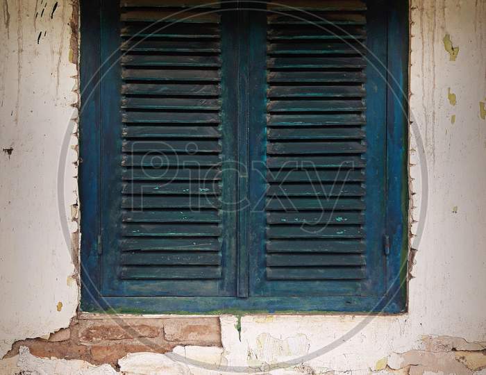Old Wooden Window Shutters Of An Mediterranean House