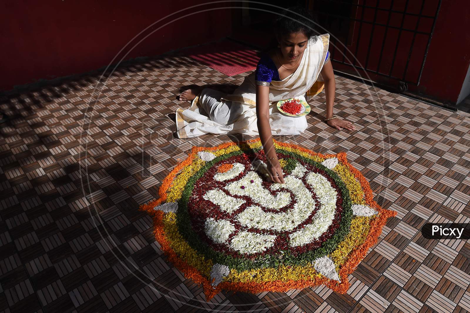 Image Of A Young Woman Prepares Pookalam On The Eve Of Onam Festival In Chennai Monday Aug 